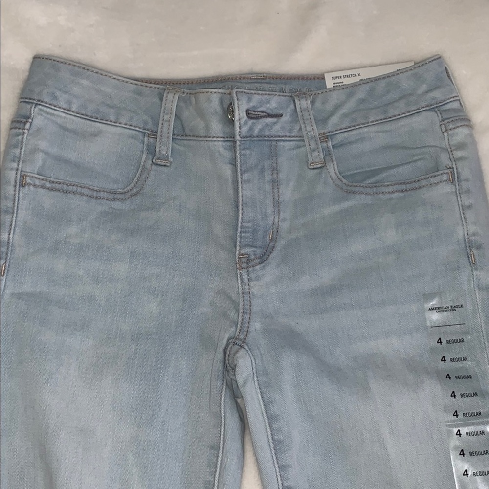 light wash distressed jeans